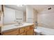 Bright bathroom with accessible features including grab bars, updated vanity, and neutral tile at 13601 E Marina Dr # 604, Aurora, CO 80014