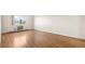 Bright bedroom featuring hardwood floors and a large window at 13601 E Marina Dr # 604, Aurora, CO 80014