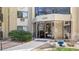 Inviting building entrance with well-maintained landscaping and visible address, offering a welcoming first impression at 13601 E Marina Dr # 604, Aurora, CO 80014