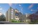 Beautiful exterior view of the building showcasing its well-maintained landscaping and modern design against a colorful sky at 13601 E Marina Dr # 604, Aurora, CO 80014
