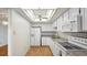Bright, well-equipped kitchen with white cabinets and modern appliances at 13601 E Marina Dr # 604, Aurora, CO 80014