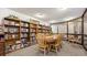 Inviting library with floor-to-ceiling bookshelves, large table, and ample seating at 13601 E Marina Dr # 604, Aurora, CO 80014