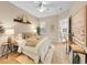 Serene bedroom featuring soft neutral tones, comfortable bedding, and ample natural light from the windows at 16366 E Fremont Ave # 3, Aurora, CO 80016