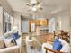 Inviting open-concept living area with a breakfast bar and hardwood flooring at 16366 E Fremont Ave # 3, Aurora, CO 80016