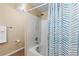 Bright bathroom featuring a shower and tub combination with tiled walls, and a modern shower head at 7440 S Blackhawk St # 205, Englewood, CO 80112