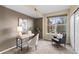 Well-lit bedroom featuring a desk, chair, and large window at 7440 S Blackhawk St # 205, Englewood, CO 80112