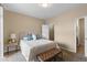 Comfortable bedroom featuring neutral tones, a plush bed, and access to a walk-in closet at 7440 S Blackhawk St # 205, Englewood, CO 80112