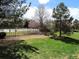 Well-maintained lawn surrounded by mature trees and landscaping at 7440 S Blackhawk St # 205, Englewood, CO 80112