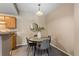 Cozy dining area with modern table setting, complemented by natural light and stylish decor at 7440 S Blackhawk St # 205, Englewood, CO 80112