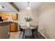 Cozy dining area featuring a round table, stylish gray chairs, and neutral decor at 7440 S Blackhawk St # 205, Englewood, CO 80112