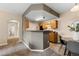 Open-concept kitchen with wooden cabinets, connecting to the dining area, perfect for entertaining at 7440 S Blackhawk St # 205, Englewood, CO 80112