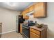 Modern kitchen with stainless steel appliances and ample cabinet space at 7440 S Blackhawk St # 205, Englewood, CO 80112