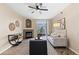 Bright living room featuring a cozy fireplace, stylish decor, and a sliding glass door to the patio at 7440 S Blackhawk St # 205, Englewood, CO 80112