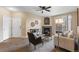 Inviting living room featuring a cozy fireplace, stylish decor, and a view of the front door at 7440 S Blackhawk St # 205, Englewood, CO 80112