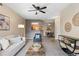 Inviting living room leading to kitchen and dining area, featuring neutral tones and natural light at 7440 S Blackhawk St # 205, Englewood, CO 80112