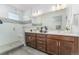 Double vanity bathroom with a large walk-in shower and modern fixtures at 9025 Southurst St, Highlands Ranch, CO 80129