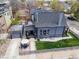 Aerial view of the house with a backyard, garage, patio, and well-maintained lawn at 2135 W 40Th Ave, Denver, CO 80211