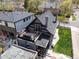 Aerial view of a house with a patio, balcony, well-maintained yard, and surrounding neighborhood at 2135 W 40Th Ave, Denver, CO 80211