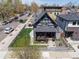 Aerial shot showcasing a gray home's exterior with a fenced yard and lovely landscaping at 2135 W 40Th Ave, Denver, CO 80211