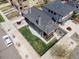 Aerial view of a gray two-story home, fenced yard, patio area, and landscaping at 2135 W 40Th Ave, Denver, CO 80211