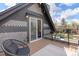 Balcony view featuring outdoor seating, stylish design and an entryway that offers a glimpse into the home's interior at 2135 W 40Th Ave, Denver, CO 80211