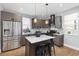 Kitchen with stainless steel appliances, granite countertops, and a center island at 2135 W 40Th Ave, Denver, CO 80211