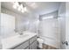 Bathroom view featuring vanity, mirror, toilet, bathtub, and a shower with a shower rod at 46566 Avery Ln, Bennett, CO 80102