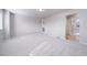 A primary bedroom with neutral carpet flooring and attached bathroom at 46566 Avery Ln, Bennett, CO 80102