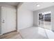 Bright room with hardwood flooring, soft carpet, fresh paint and a glass door letting in natural light at 46566 Avery Ln, Bennett, CO 80102