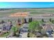 Beautiful home with a three-car garage, mature trees, and a large field view at 6800 Saddleback Ave, Firestone, CO 80504