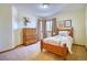 This bedroom features carpeted floors, neutral walls, and natural light at 6800 Saddleback Ave, Firestone, CO 80504