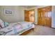 This bedroom features carpeted floors, neutral walls, and natural light at 6800 Saddleback Ave, Firestone, CO 80504