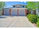 Charming two-story home featuring a three-car garage, brick accents, and well-maintained landscaping at 6800 Saddleback Ave, Firestone, CO 80504