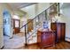 Welcoming foyer featuring tile flooring, staircase, and decorative accents at 6800 Saddleback Ave, Firestone, CO 80504