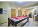 This finished basement features a game room and office space, perfect for relaxation and productivity at 6800 Saddleback Ave, Firestone, CO 80504