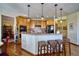 Charming kitchen features a breakfast bar with granite countertops and stylish pendant lighting at 6800 Saddleback Ave, Firestone, CO 80504