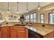 Granite countertops and a double sink enhance this contemporary kitchen design at 6800 Saddleback Ave, Firestone, CO 80504