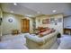 Finished basement featuring a comfortable living room with carpeted floors and cozy furnishings at 6800 Saddleback Ave, Firestone, CO 80504