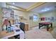 This finished basement features a home office space, perfect for relaxation and productivity at 6800 Saddleback Ave, Firestone, CO 80504