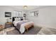 Serene bedroom featuring soft lighting, a comfortable bed with plush bedding, and stylish decor for relaxation at 977 S Reed St, Lakewood, CO 80226