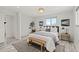 Bright and airy bedroom with large windows, cozy bedding, and tasteful decor creating a peaceful retreat at 977 S Reed St, Lakewood, CO 80226