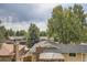Residential neighborhood featuring well-kept homes with mature landscaping and tree coverage at 9014 W Harvard Dr, Lakewood, CO 80227