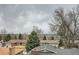 Residential neighborhood view with well-maintained homes and mature trees at 9014 W Harvard Dr, Lakewood, CO 80227