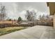 Backyard patio with fenced yard and landscaping at 9014 W Harvard Dr, Lakewood, CO 80227