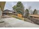 Backyard patio with fenced yard and landscaping at 9014 W Harvard Dr, Lakewood, CO 80227