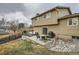 Backyard patio with outdoor furniture, grill, and landscaped yard at 9014 W Harvard Dr, Lakewood, CO 80227