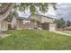 Two story home with brick and siding exterior at 9014 W Harvard Dr, Lakewood, CO 80227