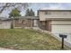 Charming home featuring a brick facade and a well-maintained front yard with mature trees at 9014 W Harvard Dr, Lakewood, CO 80227