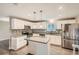 Updated kitchen with stainless steel appliances and an island at 9014 W Harvard Dr, Lakewood, CO 80227