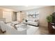 Bright living room features a large window, plush seating, and modern decor at 9014 W Harvard Dr, Lakewood, CO 80227
